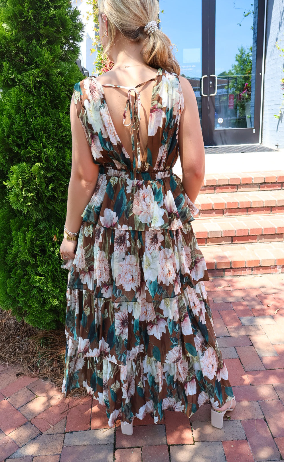 Brown floral tiered maxi dress with a V-neck and ruffled skirt