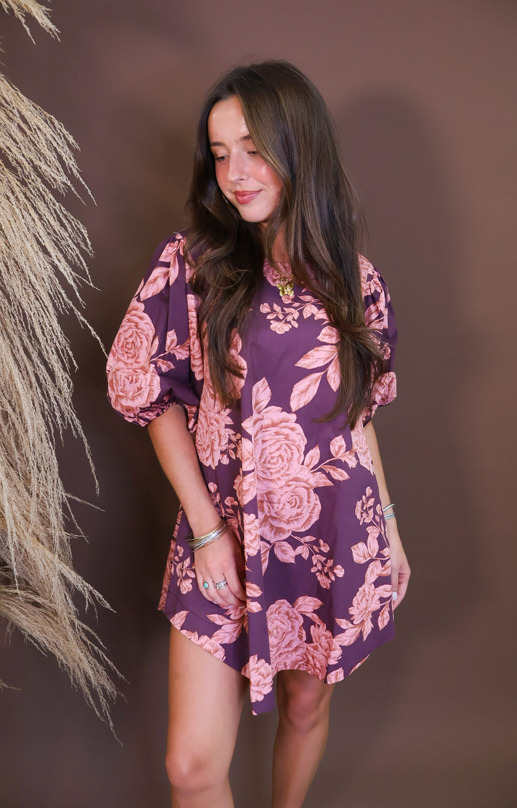 Model wearing the Wine Pink Floral Mini Dress from Moda Boutique