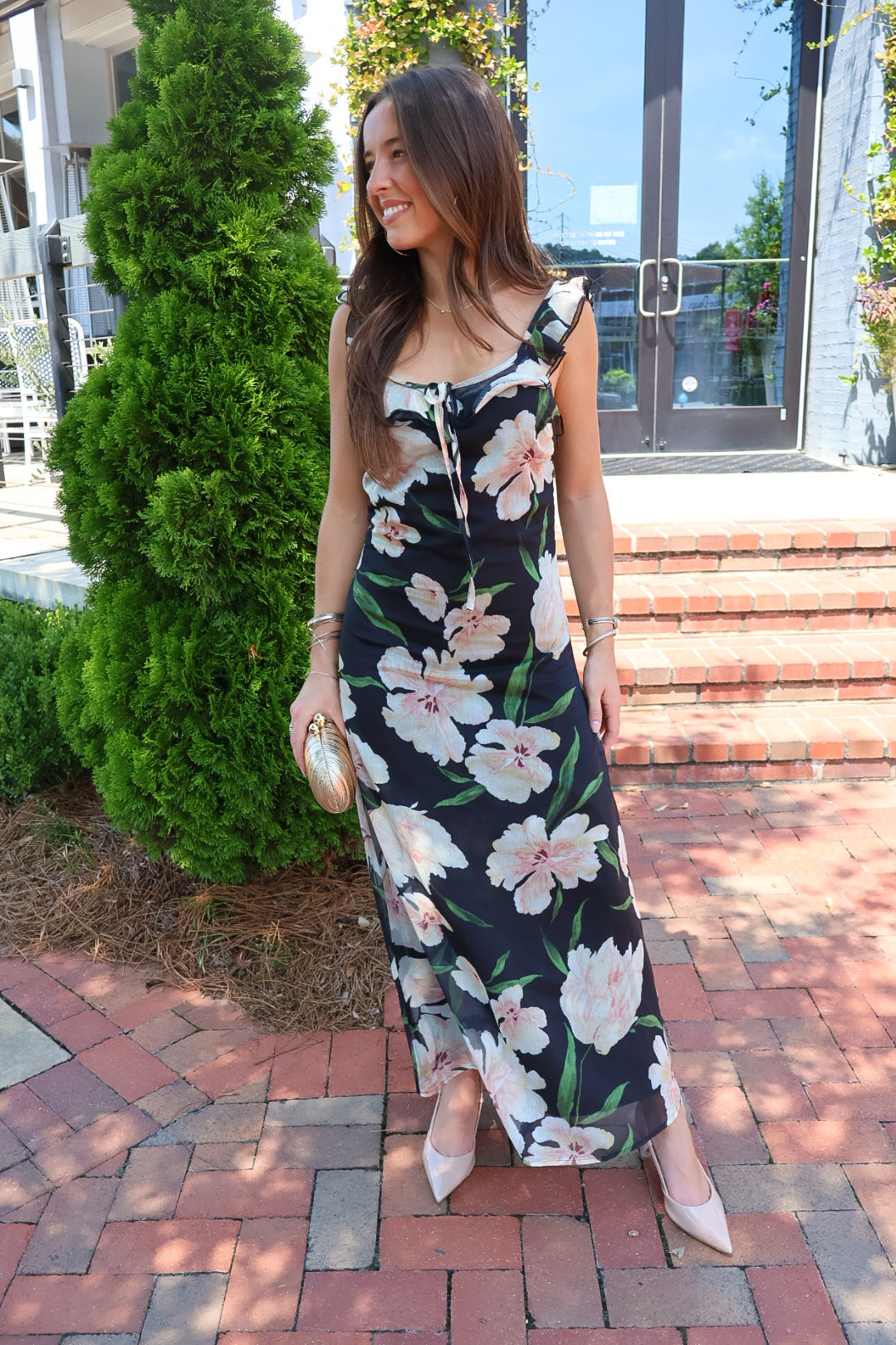 Black floral maxi dress with blush and cream blooms, ruffle straps, and a self-tie bust