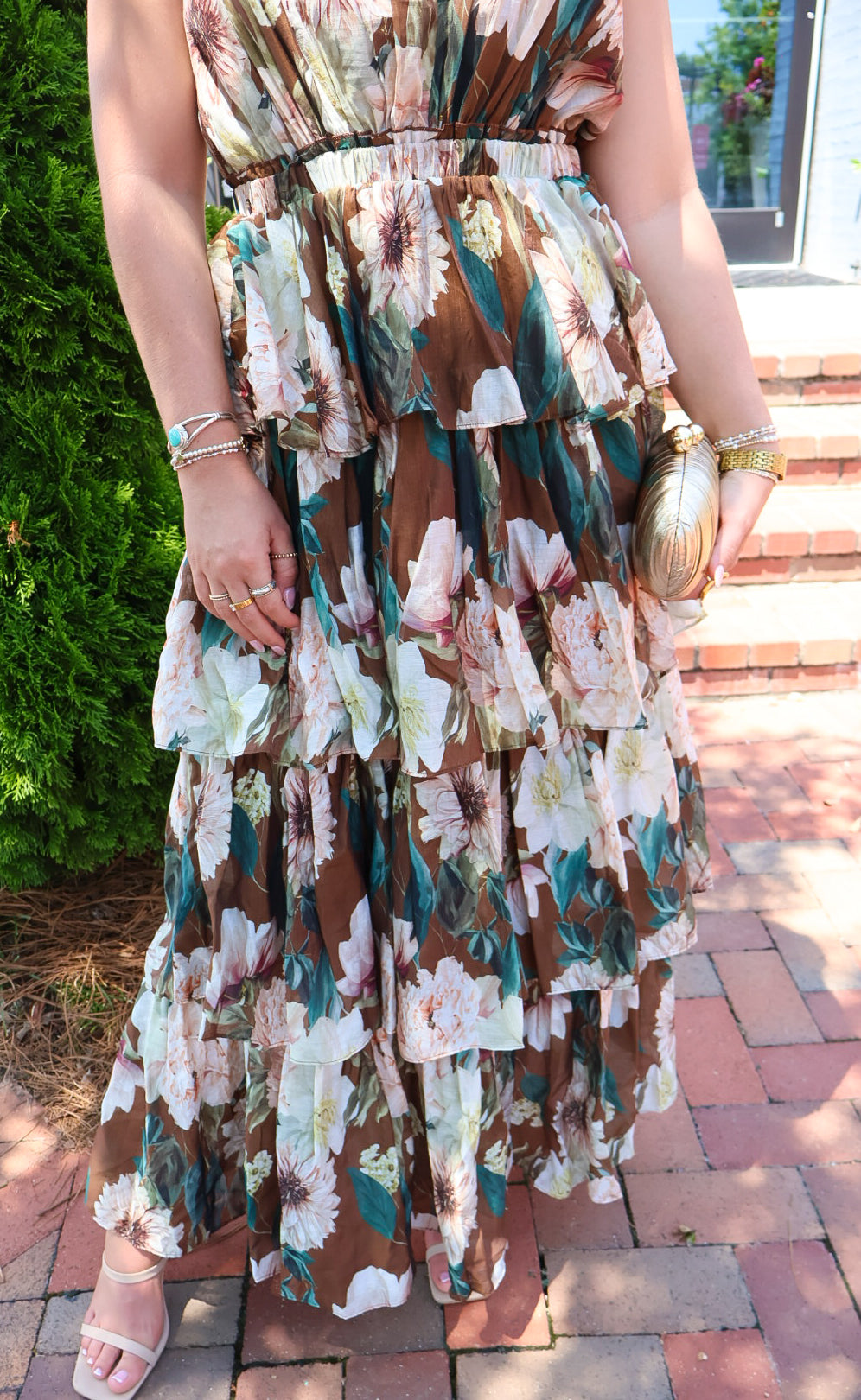 Brown floral tiered maxi dress with a V-neck and ruffled skirt