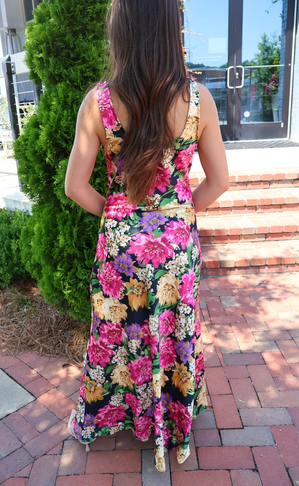 Black floral satin maxi dress with twisted straps and a draped cowl neckline