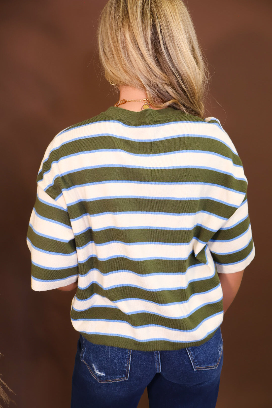 Model wearing the Short Sleeved Lightweight Sweater Top - Green Stripe from Moda Boutique