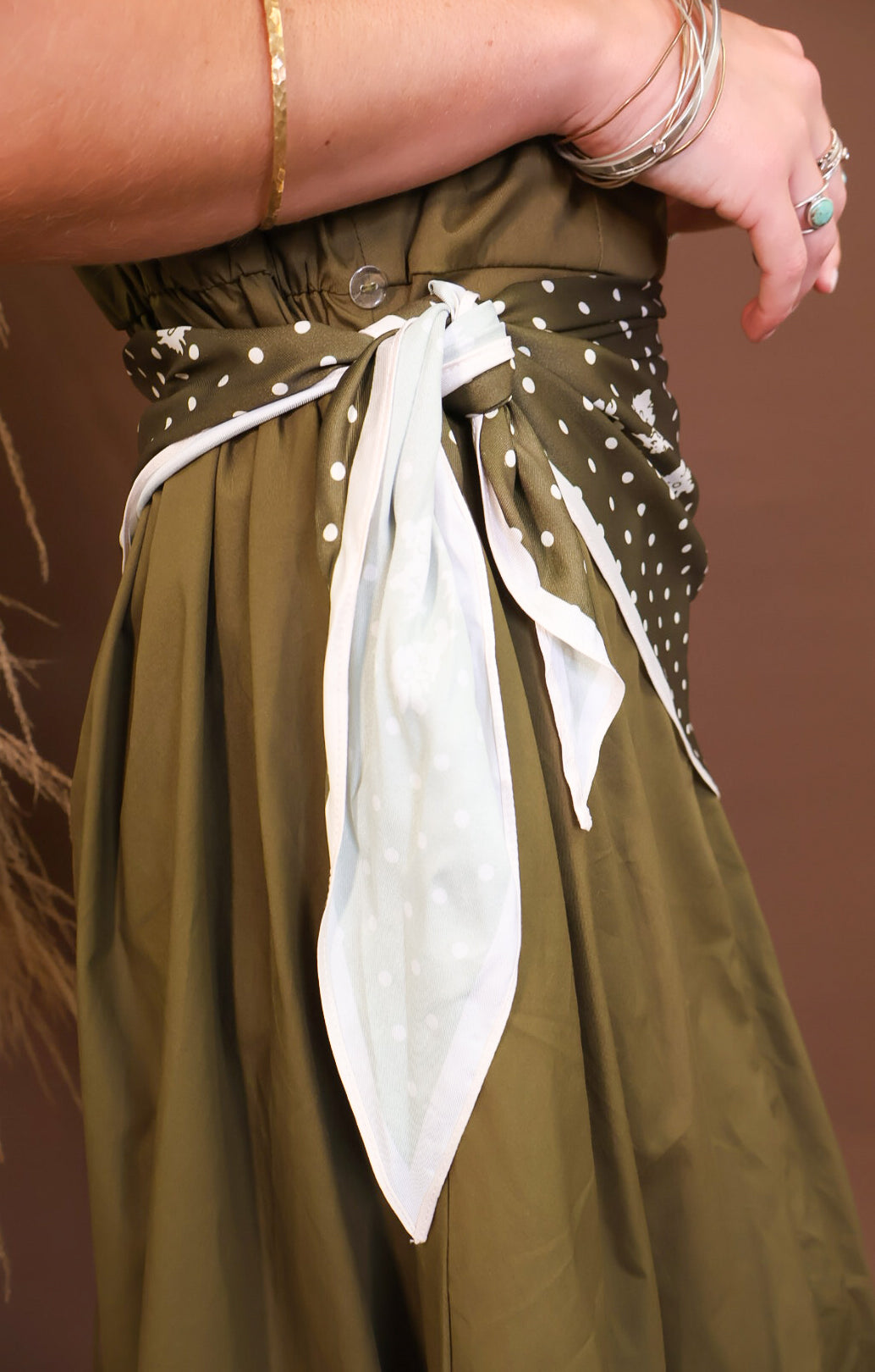 Model wearing the Olive Bubble Midi Dress with Scarf from Moda Boutique