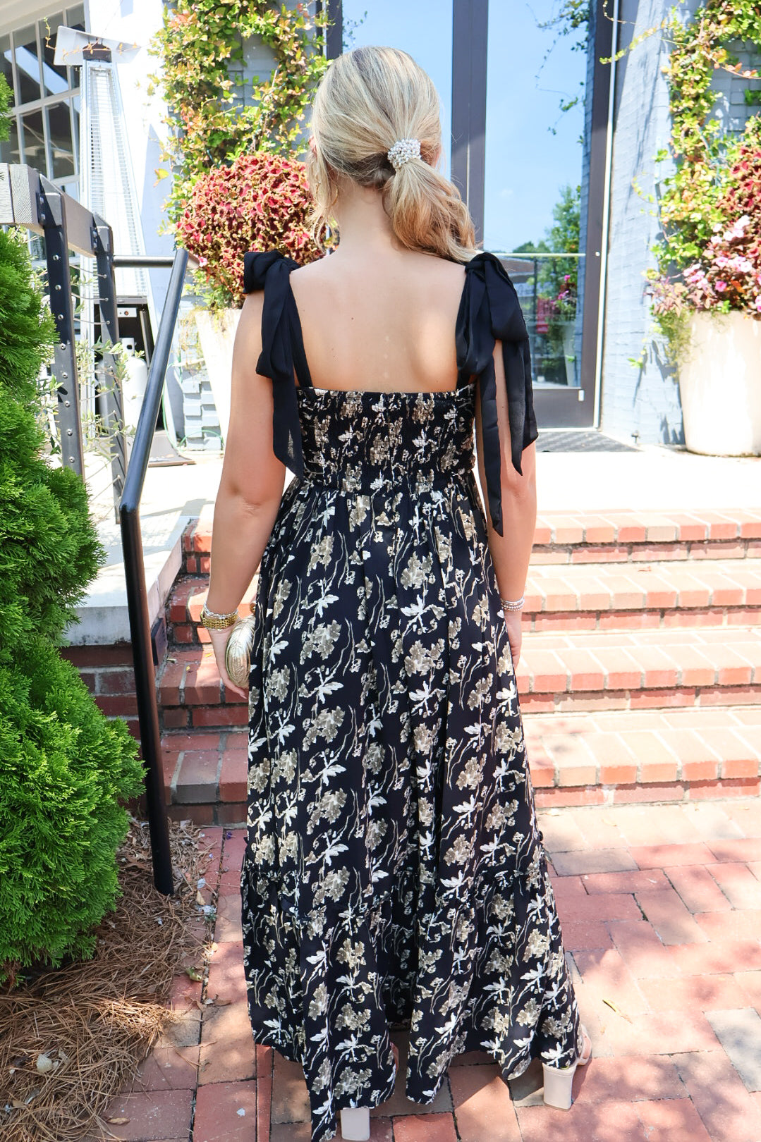 Black maxi dress with gold floral embroidery and ribbon shoulder ties