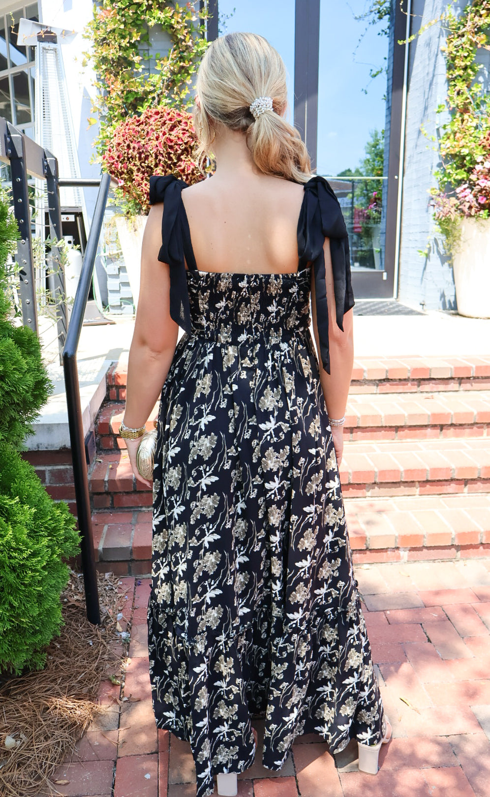 Black maxi dress with gold floral embroidery and ribbon shoulder ties