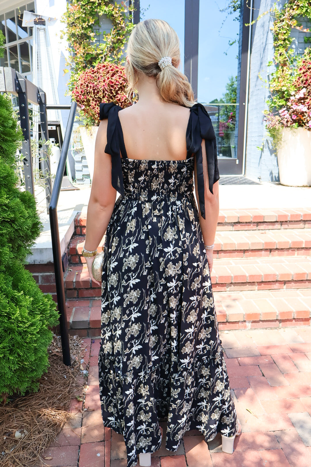 Black maxi dress with gold floral embroidery and ribbon shoulder ties