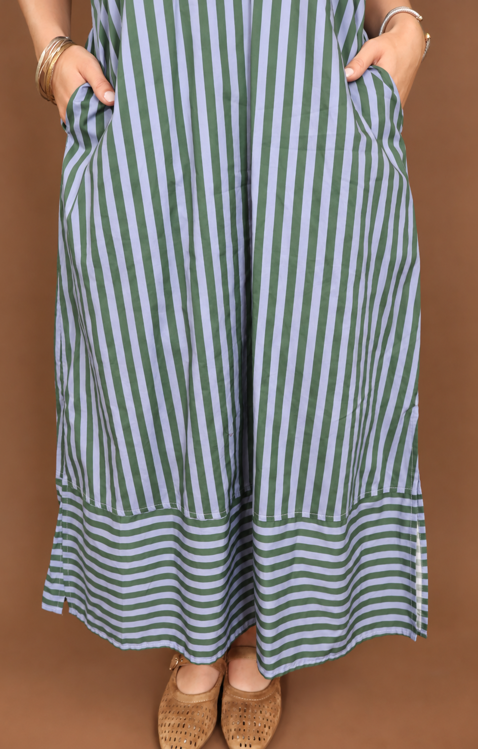 Model wearing the Blue Green Striped Midi Dress from Moda Boutique