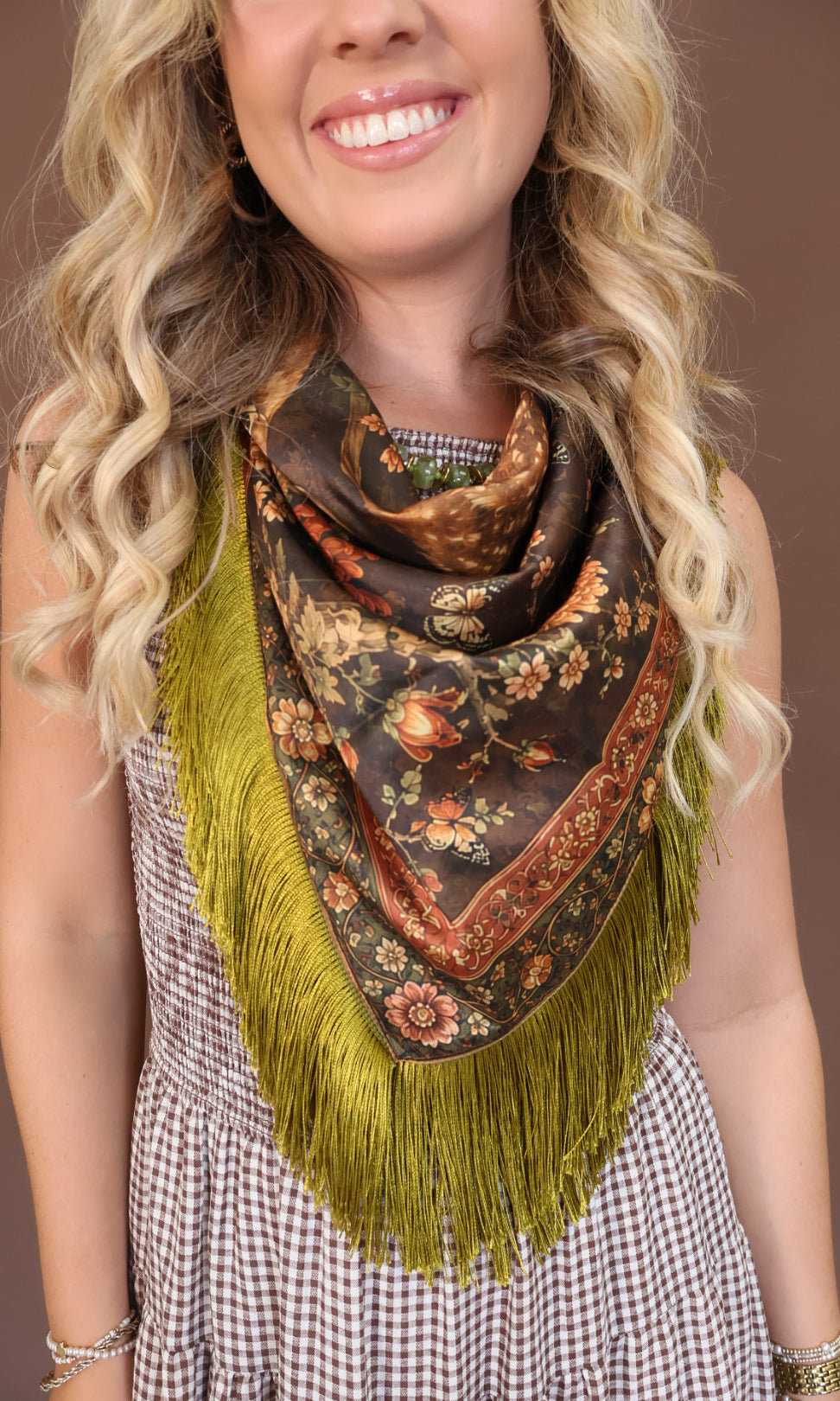 Green Deer Print Fringe Square Scarf — close-up of neck styling.