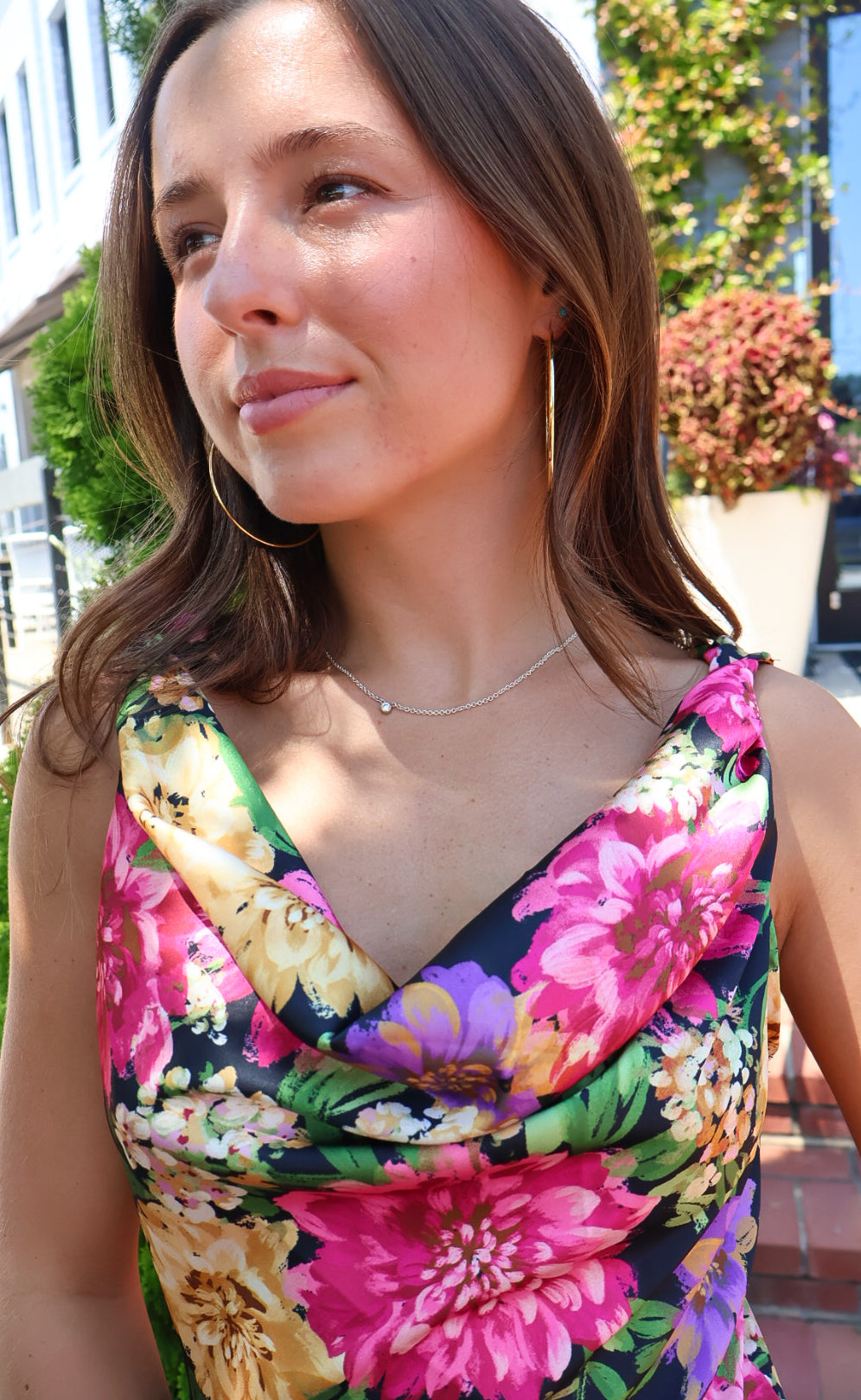 Black floral satin maxi dress with twisted straps and a draped cowl neckline