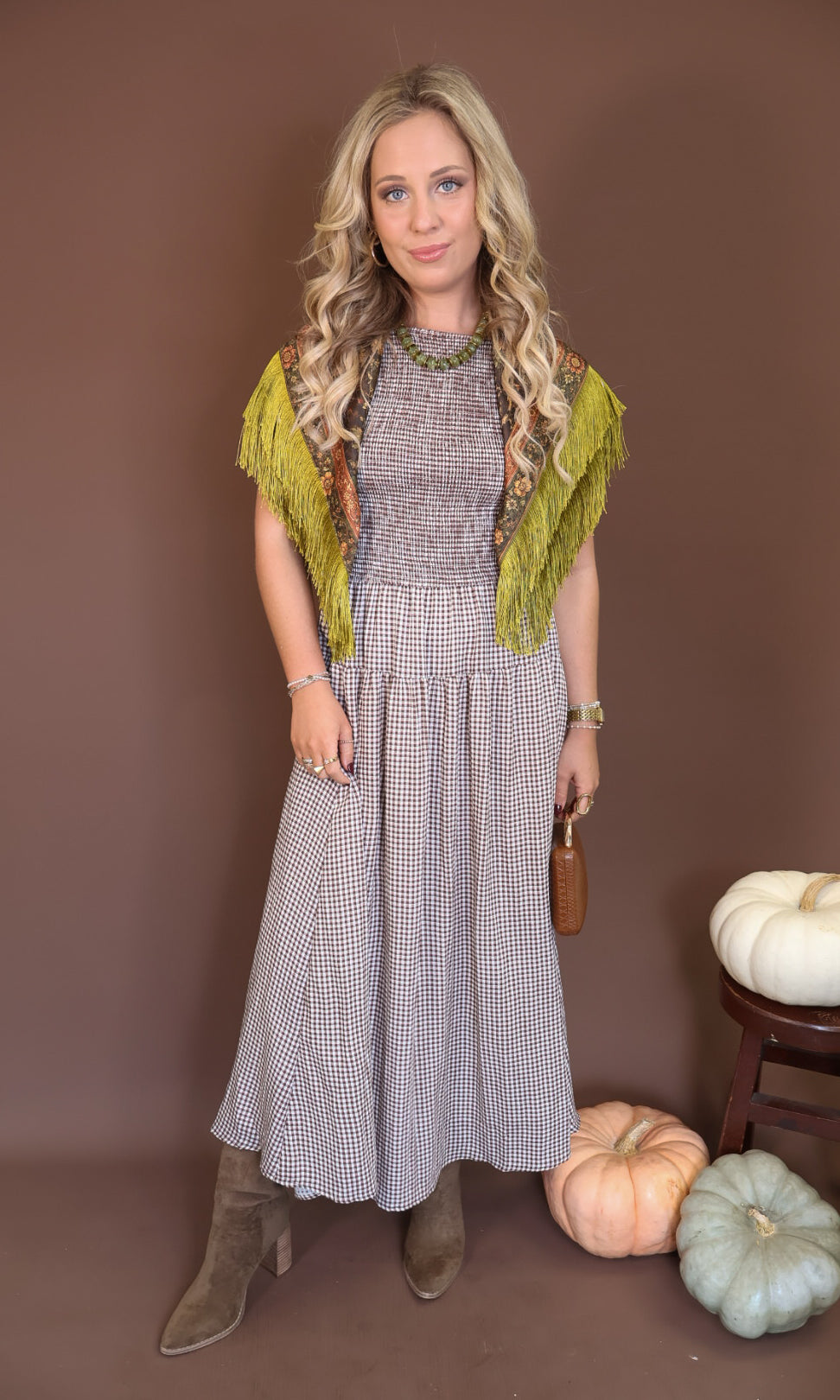Brown Gingham Smocked Sleeveless Midi Dress — styled with a printed scarf around the shoulders.