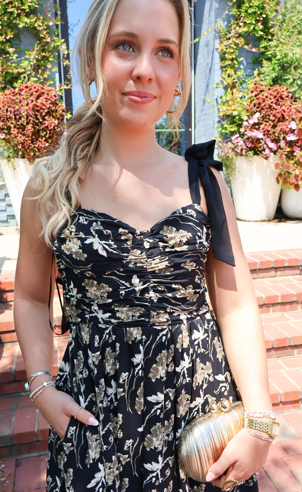 Black maxi dress with gold floral embroidery and ribbon shoulder ties
