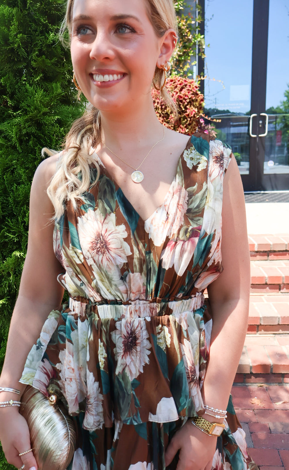 Brown floral tiered maxi dress with a V-neck and ruffled skirt