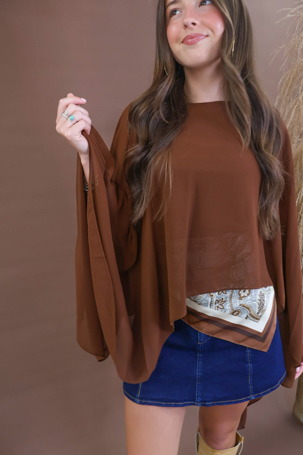 Chocolate sheer batwing poncho top layered over included cami