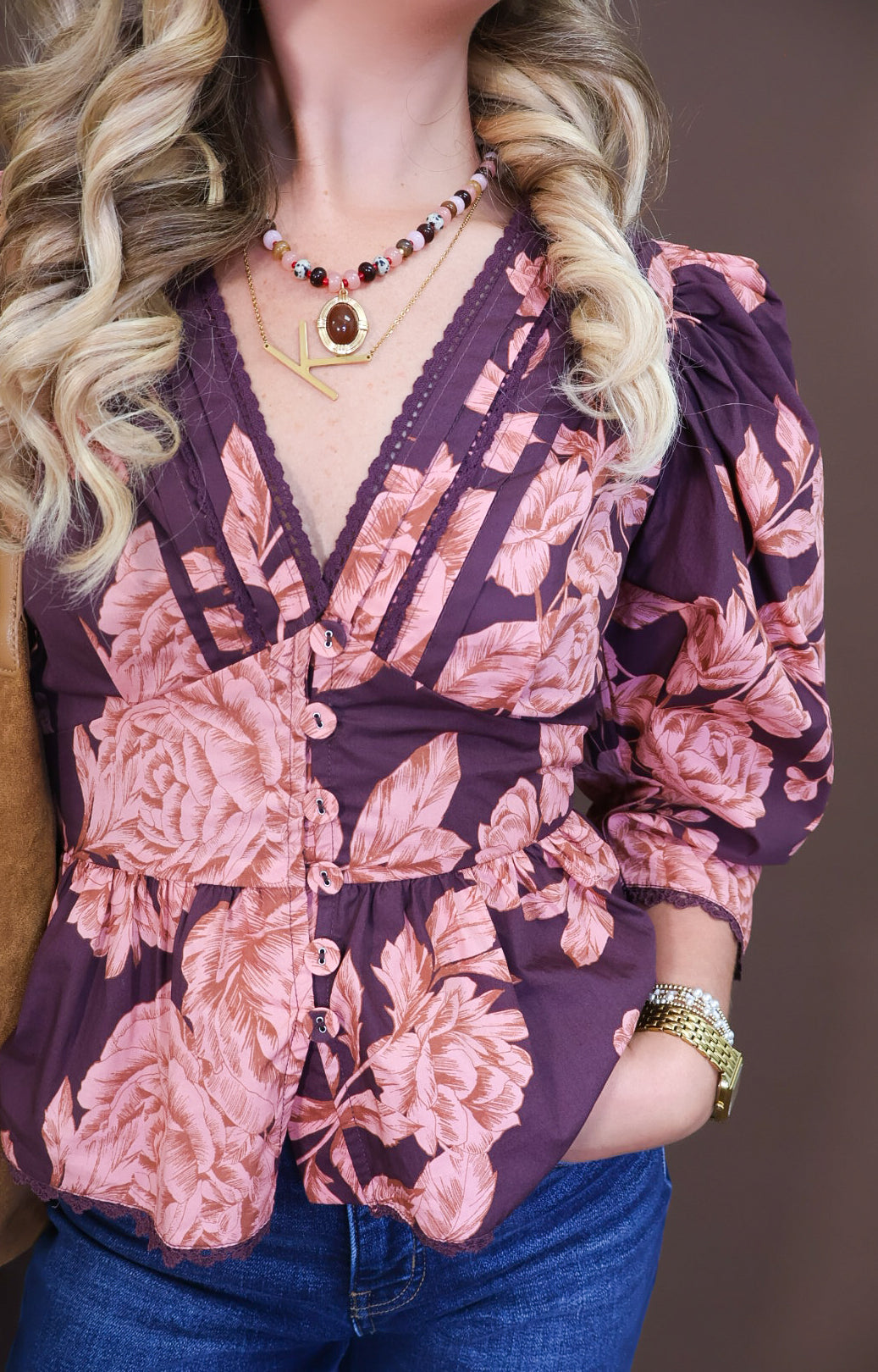 Model wearing the Wine Pink Floral V Neck Top from Moda Boutique