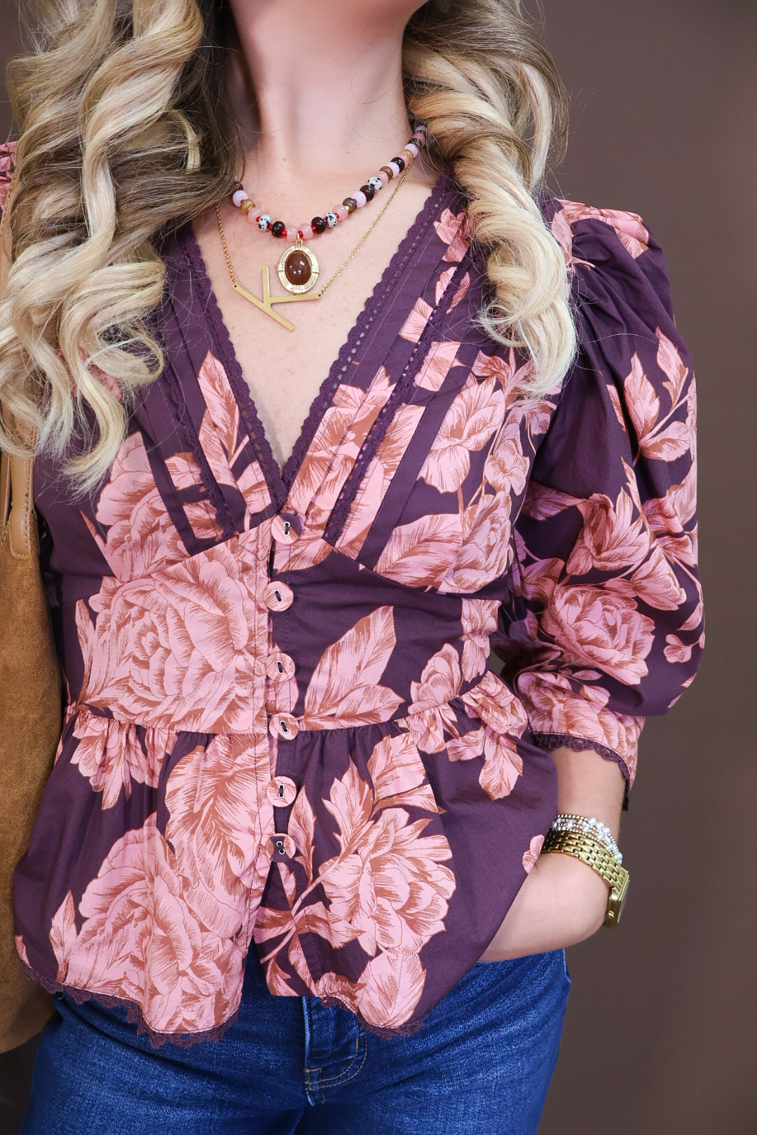 Model wearing the Wine Pink Floral V Neck Top from Moda Boutique