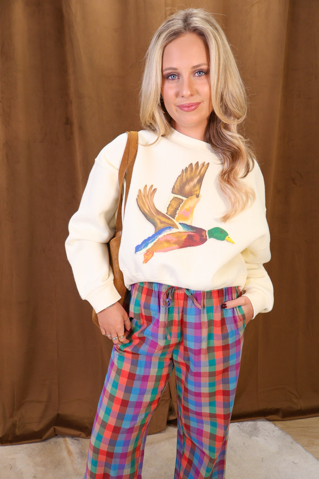 Cream cropped mallard graphic sweatshirt — front view.
