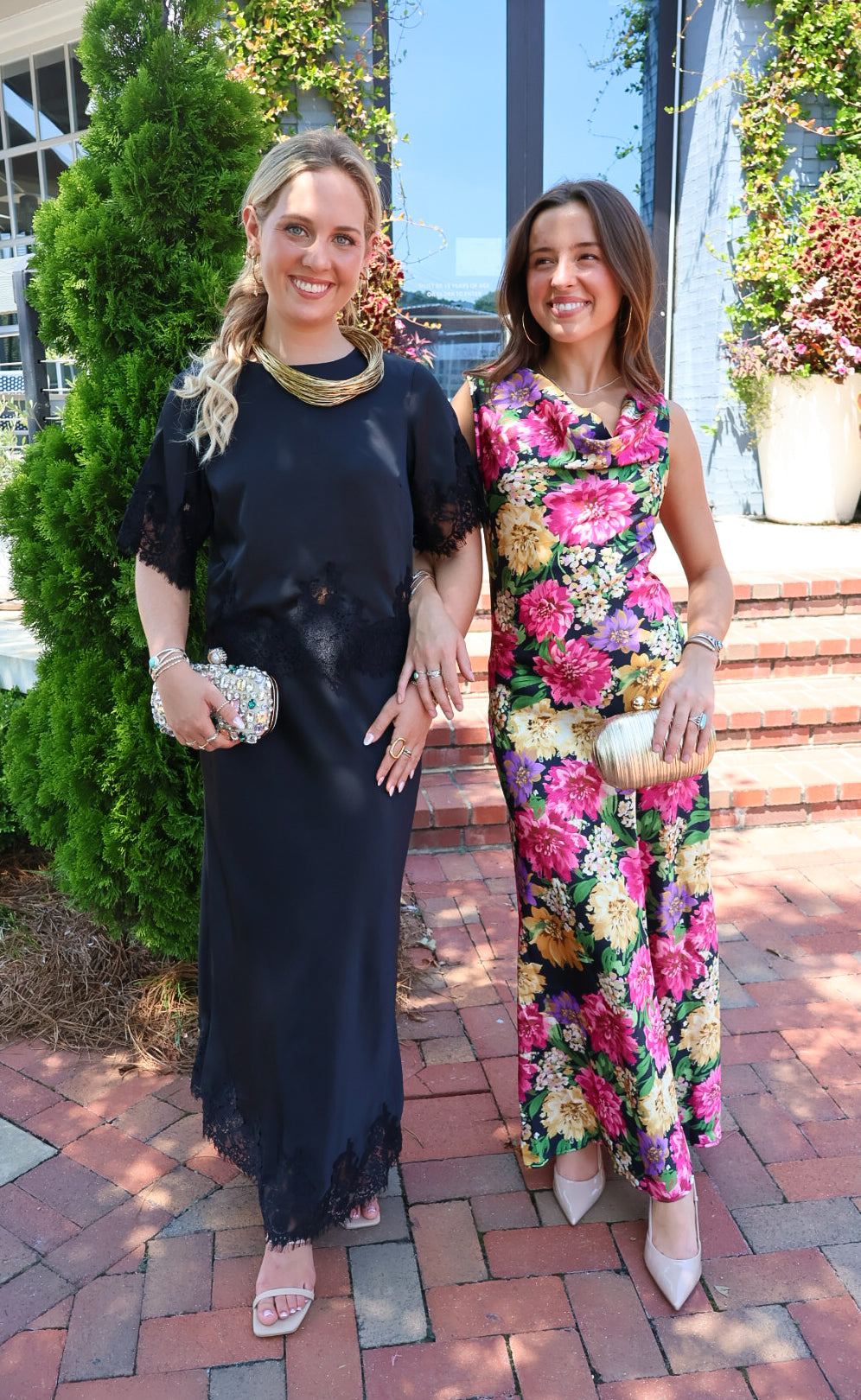 Black satin two-piece set with a lace-trim crop top and matching lace-trim skirt