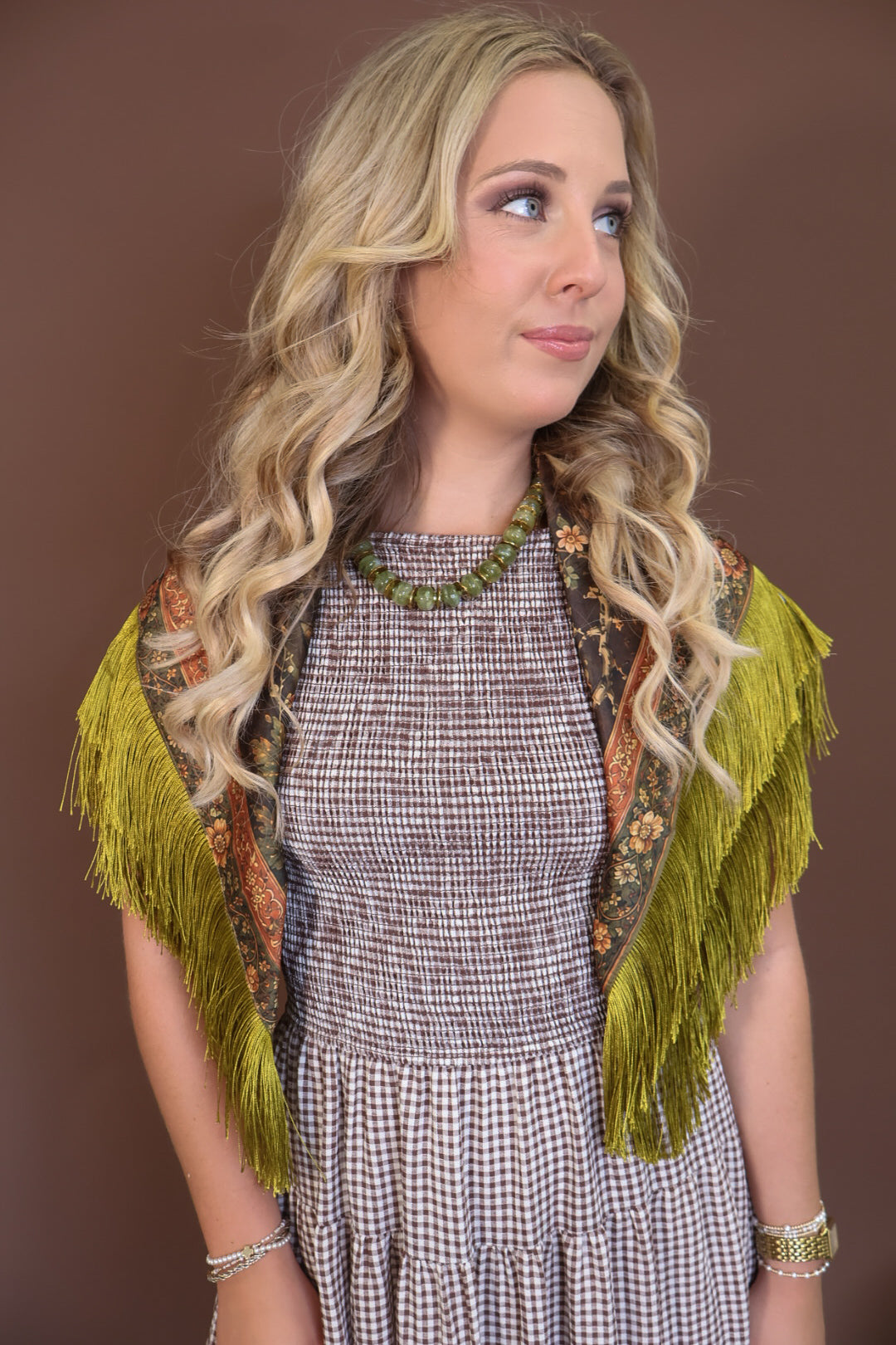 Green Deer Print Fringe Square Scarf — draped over the shoulders.