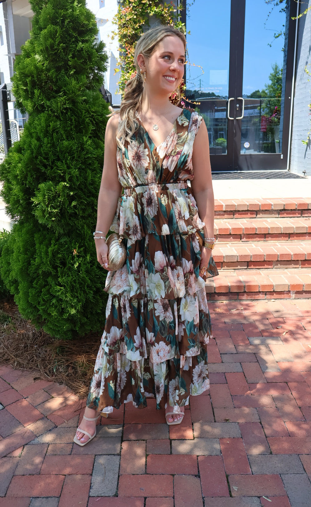 Brown floral tiered maxi dress with a V-neck and ruffled skirt