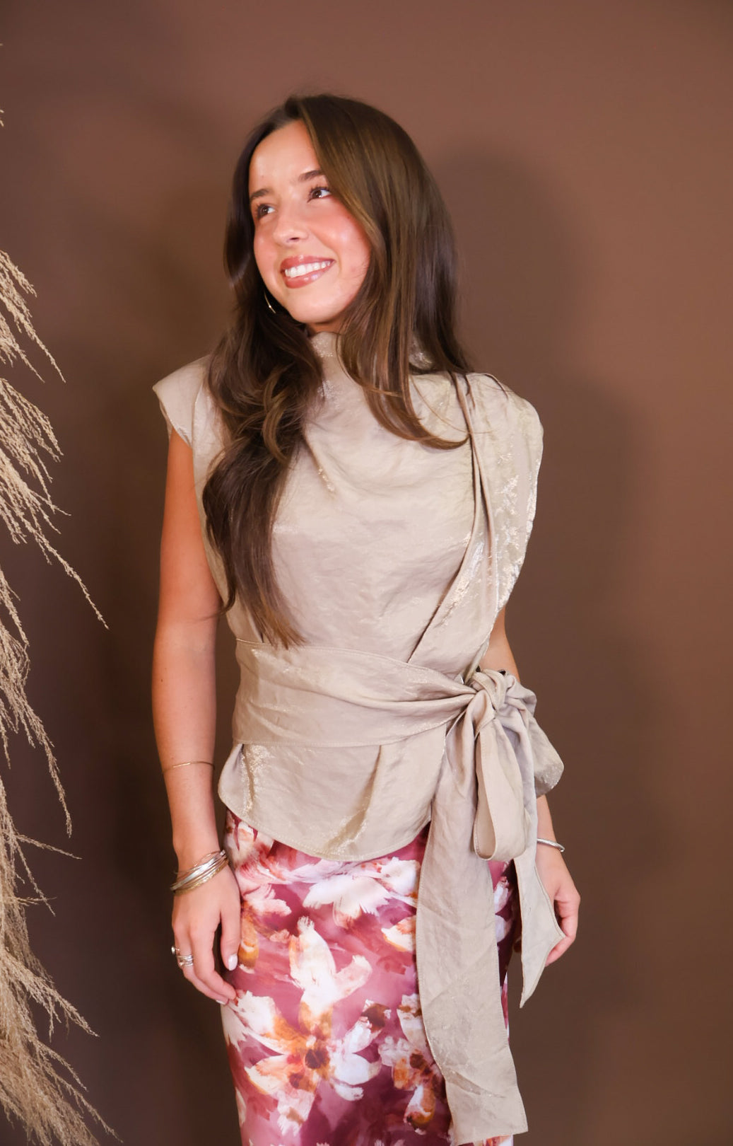 Model wearing the Taupe Waist Tie Sleeveless Top from Moda Boutique