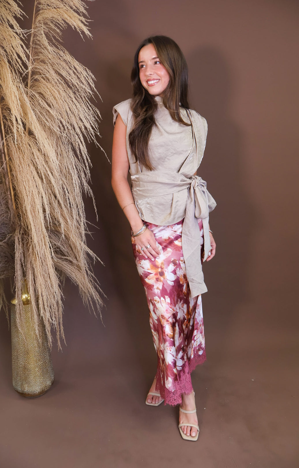 Model wearing the Taupe Waist Tie Sleeveless Top from Moda Boutique