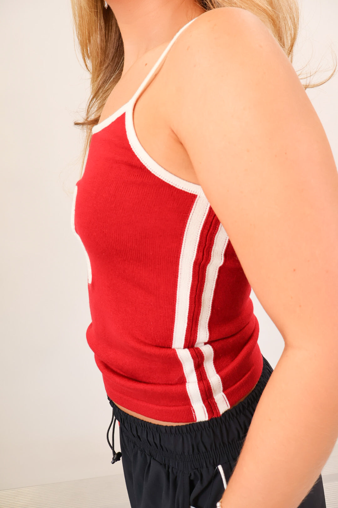 Crimson knit tank top with white script A and adjustable straps — view 5