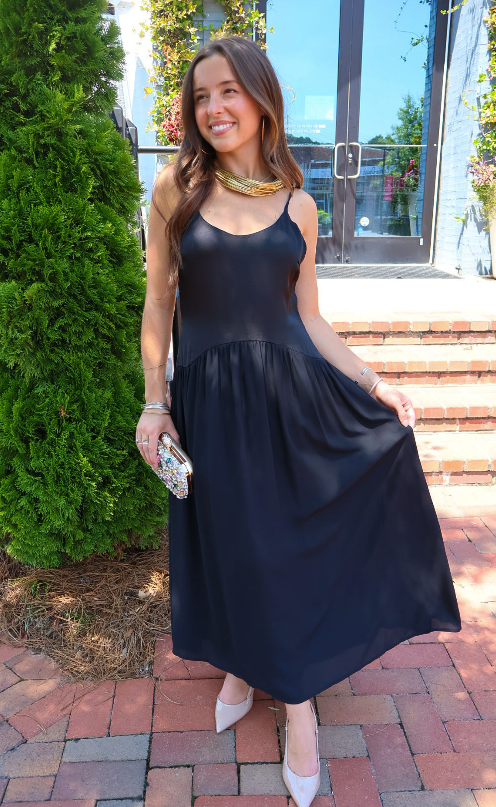 Black satin cami maxi dress with a scooped neck and flowy gathered skirt