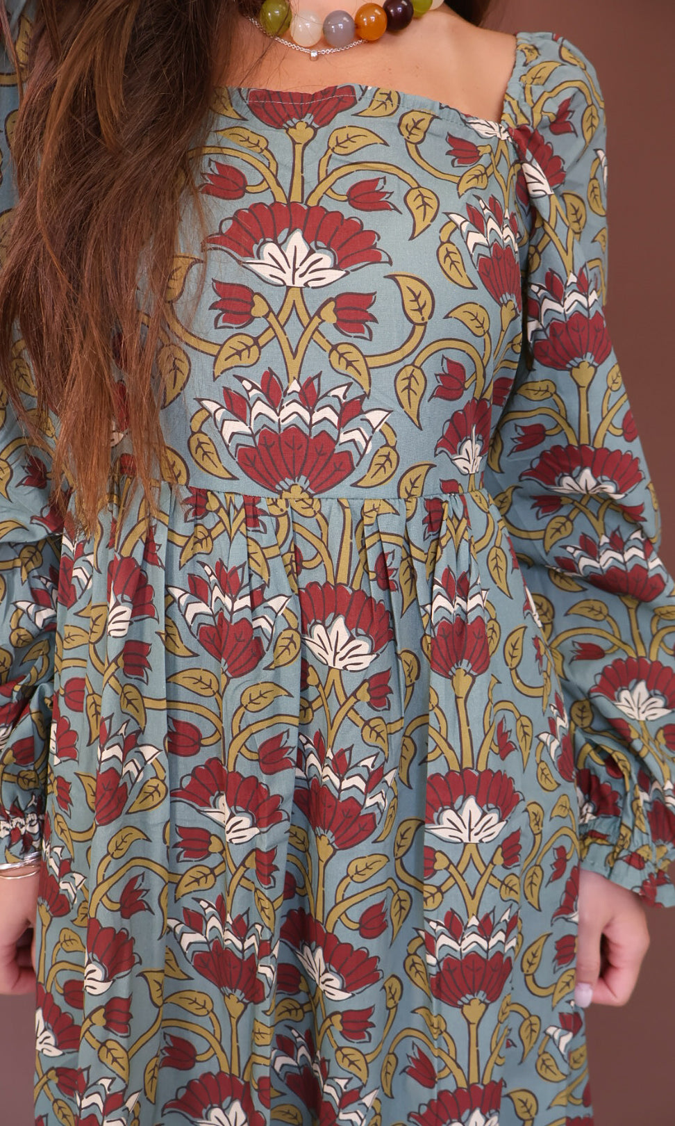 Sage And Burgundy Floral Long Sleeve Maxi Dress — close-up of gathered bodice.