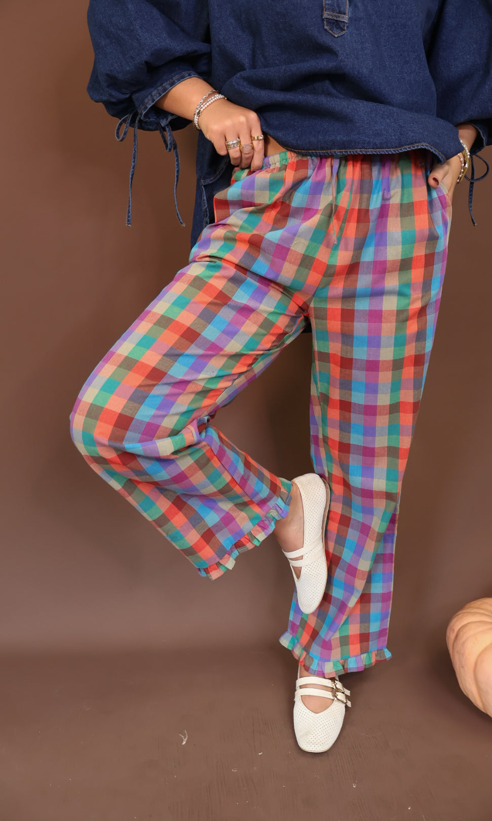 Multicolor Plaid Ruffle Hem Pants — side view of relaxed pant legs.