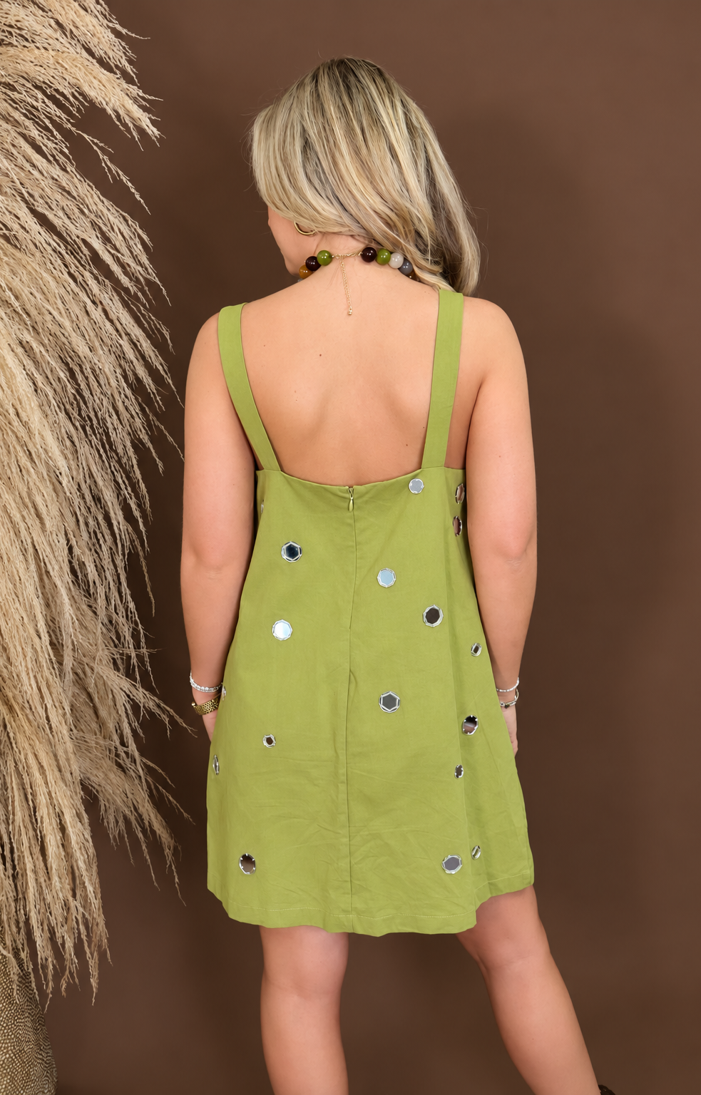 Model wearing the Chartreuse Mirrored Sequin Shift Dress from Moda Boutique