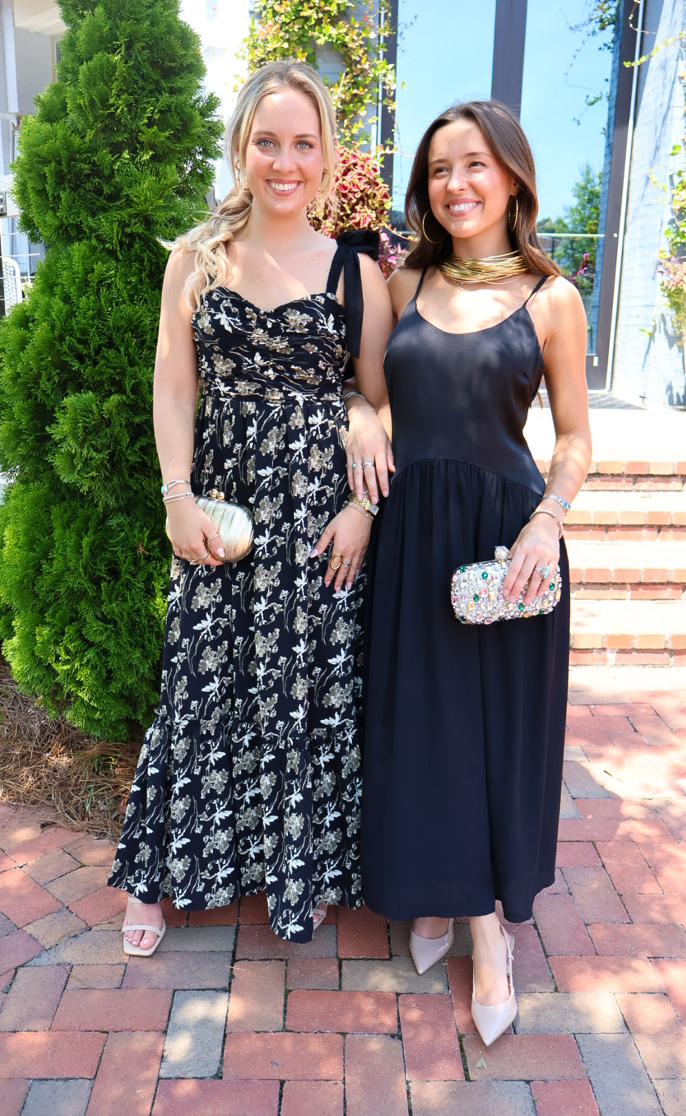 Black satin cami maxi dress with a scooped neck and flowy gathered skirt