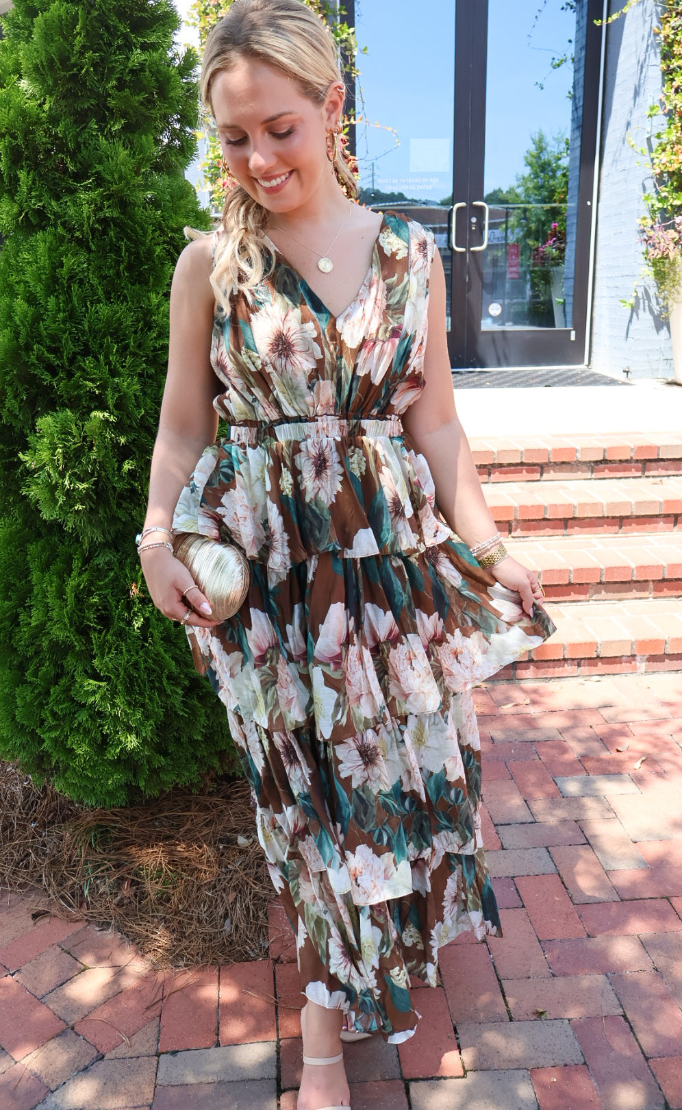 Brown floral tiered maxi dress with a V-neck and ruffled skirt