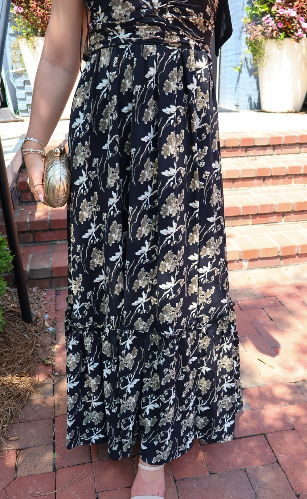 Black maxi dress with gold floral embroidery and ribbon shoulder ties