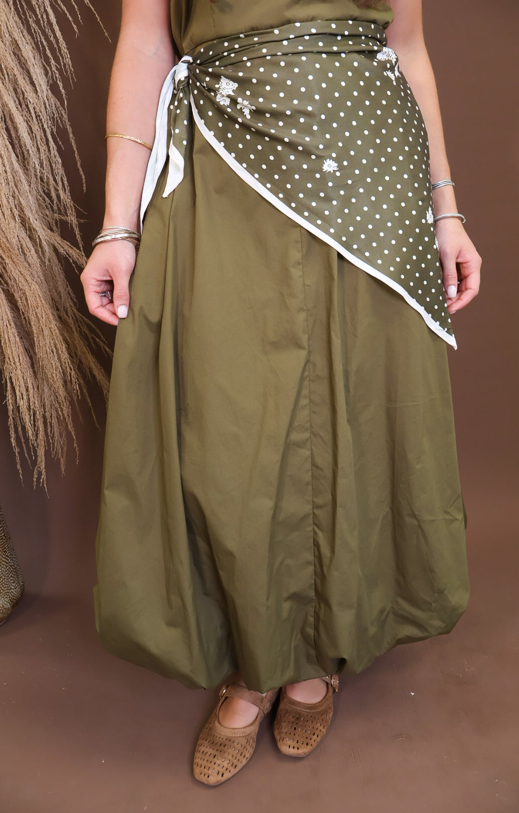 Model wearing the Olive Bubble Midi Dress with Scarf from Moda Boutique