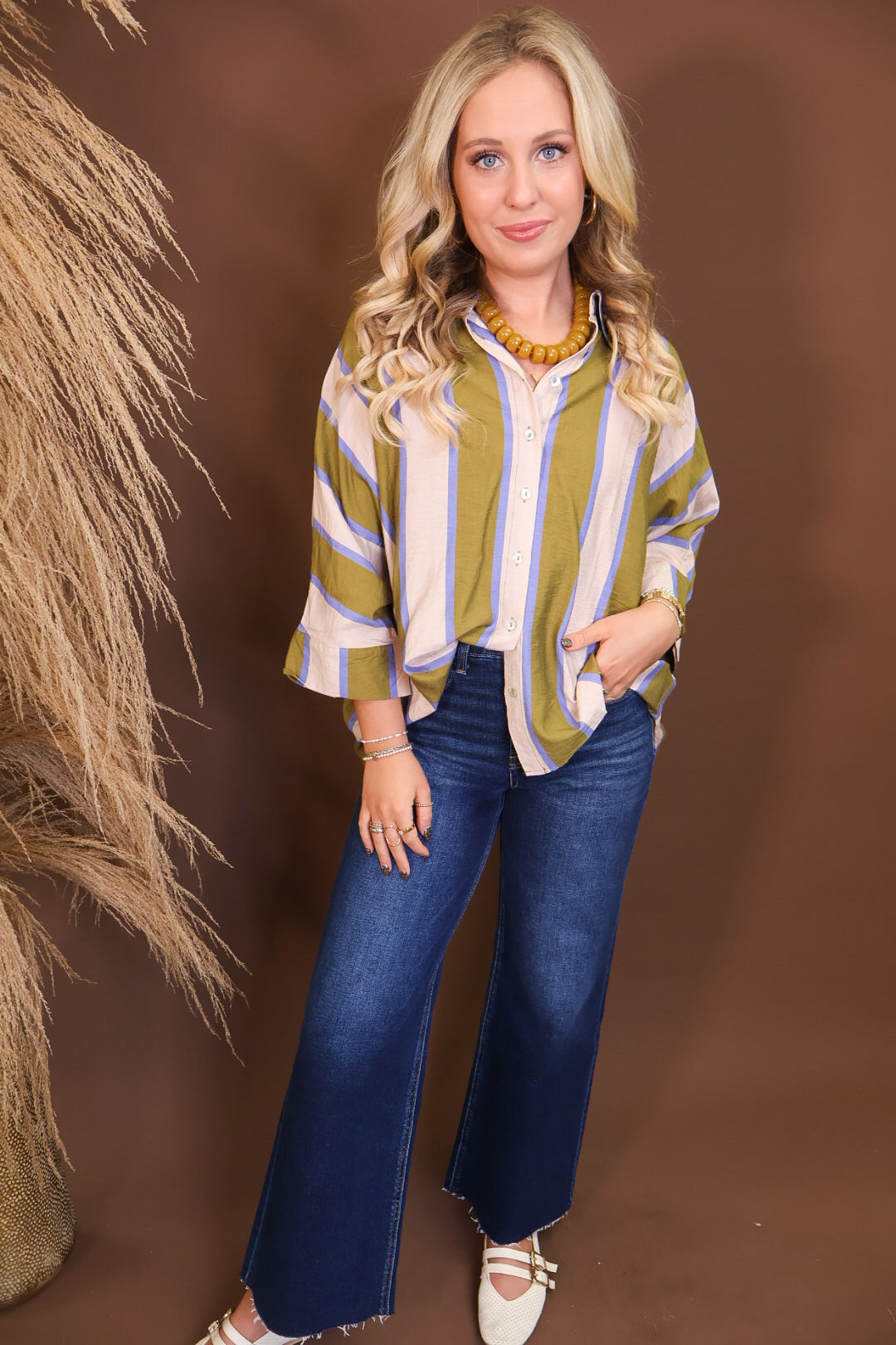 Model wearing the Olive & Blue Striped Button Down Top from Moda Boutique
