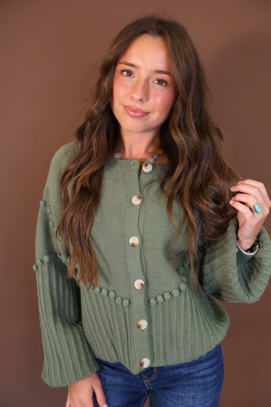 Olive Pom Pom Knit Cardigan — front view.