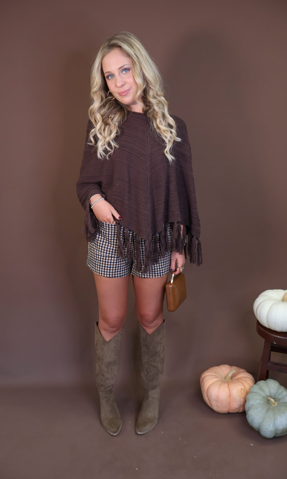 Chocolate Brown Crochet Fringe Poncho Top — full outfit with plaid shorts.