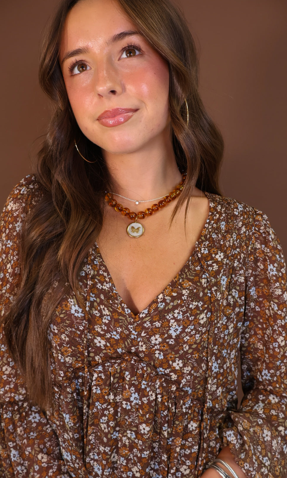 Brown Floral Long Sleeve Midi Dress — close-up of V-neckline and floral print.