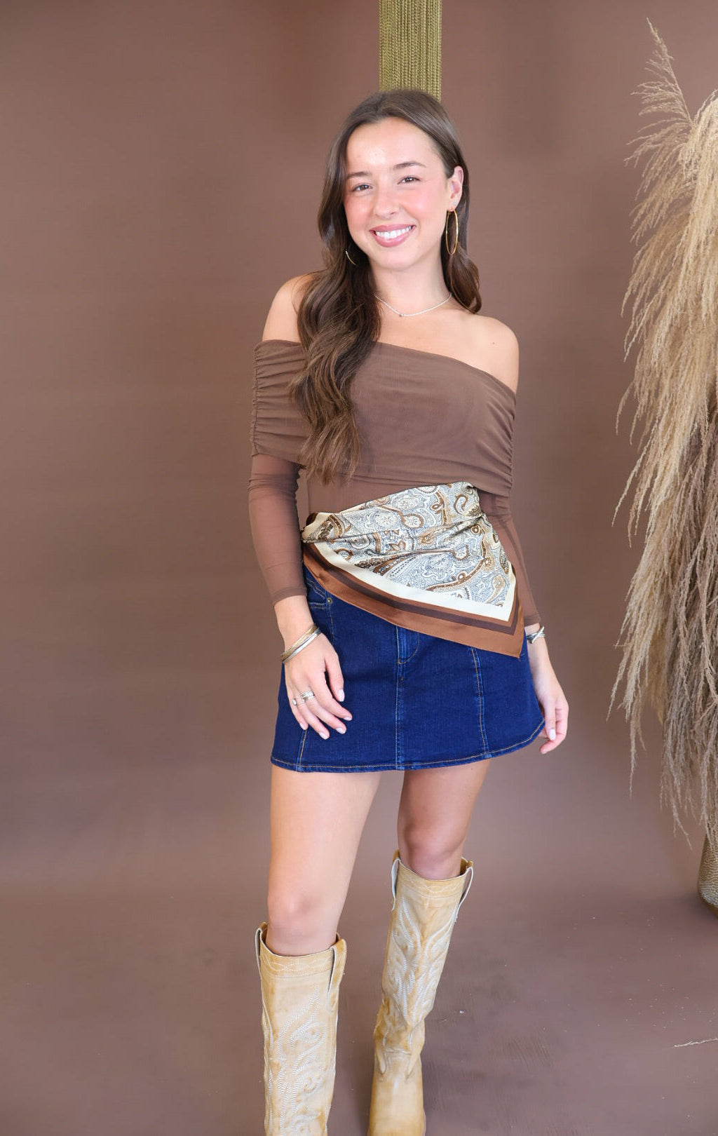 Cream and brown paisley scarf tied at the waist
