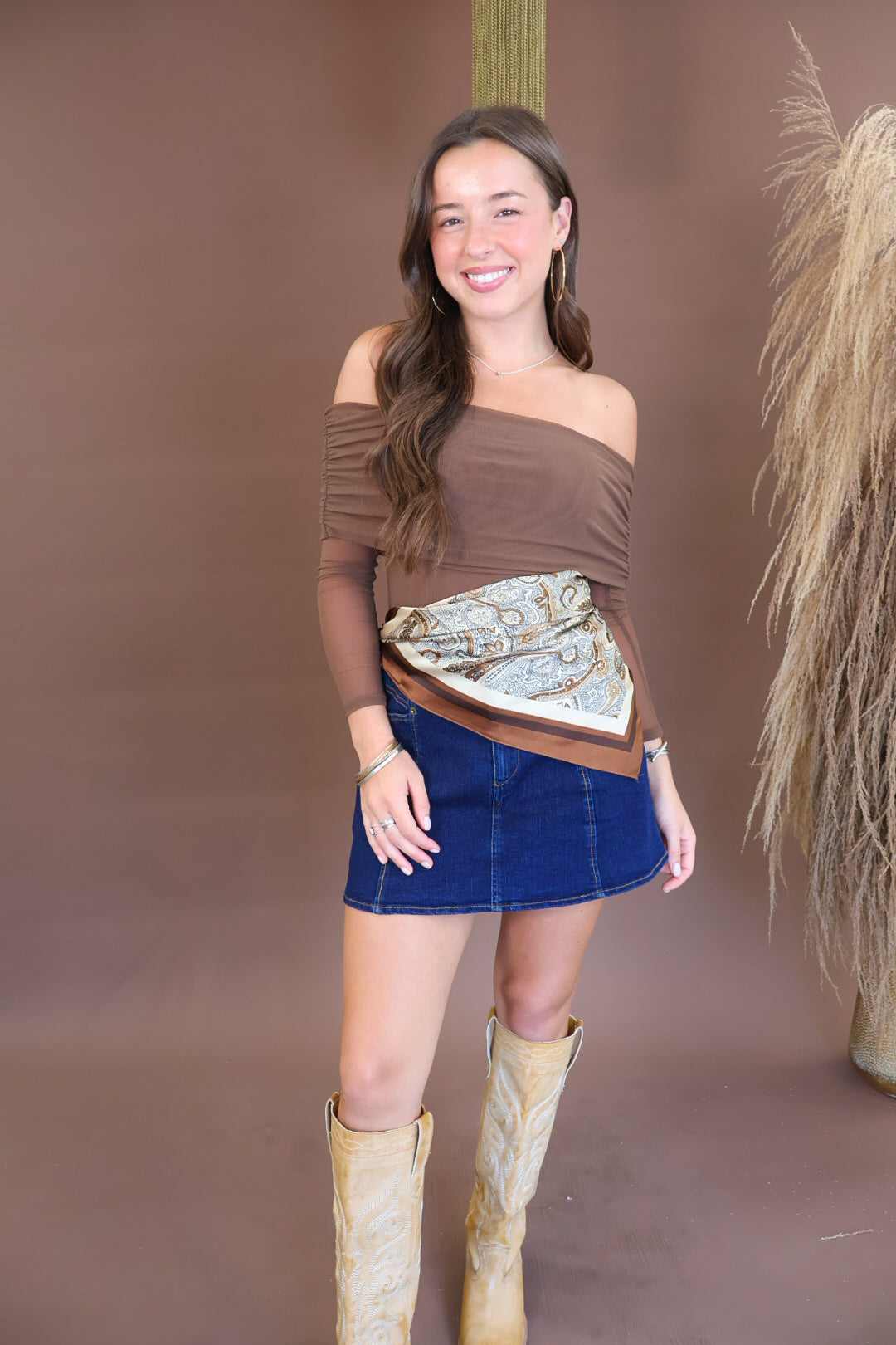 Cream and brown paisley scarf tied at the waist