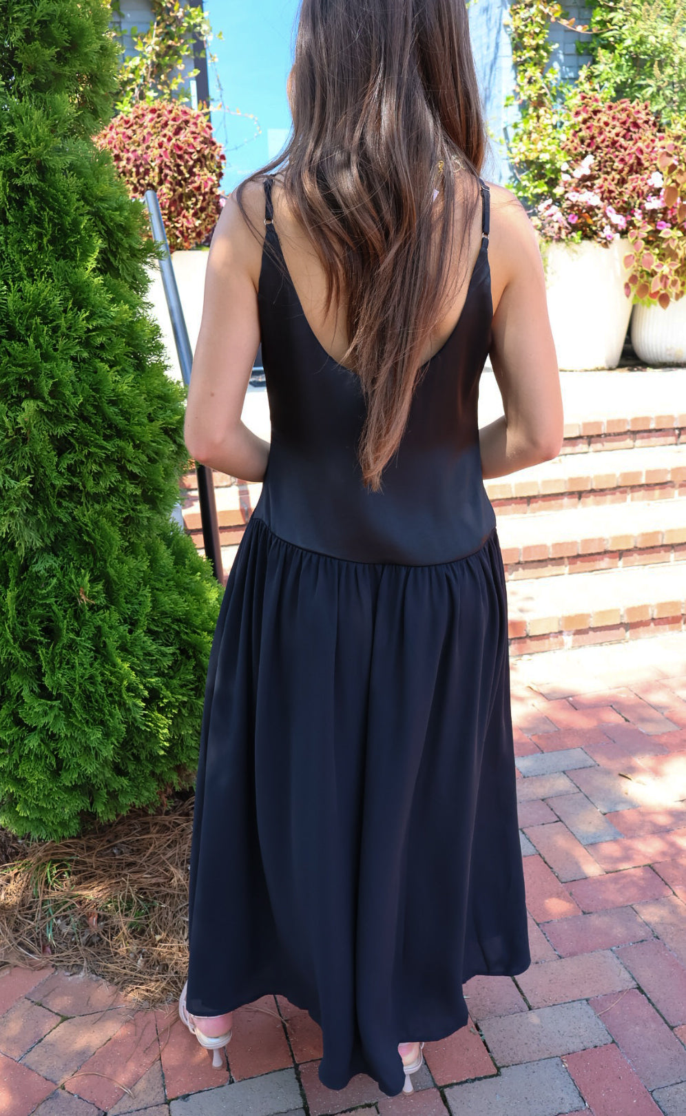 Black satin cami maxi dress with a scooped neck and flowy gathered skirt