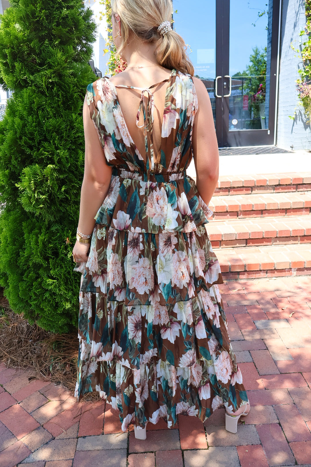 Brown floral tiered maxi dress with a V-neck and ruffled skirt