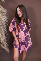Model wearing the Wine Pink Floral Mini Dress from Moda Boutique