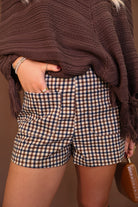 Brown Plaid Pocket-Front Shorts — close-up of front patch pockets and plaid.