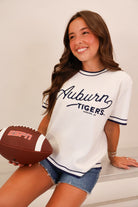 White Auburn Tigers script sweater top with navy ringer trim on model