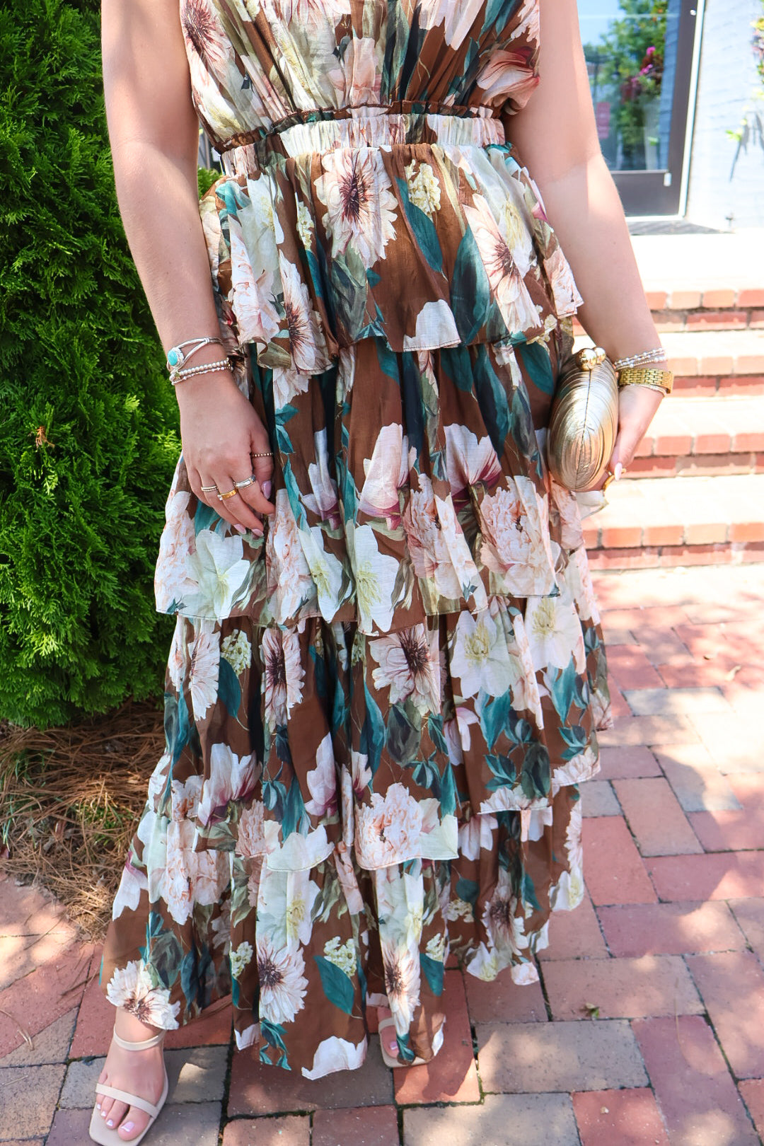 Brown floral tiered maxi dress with a V-neck and ruffled skirt