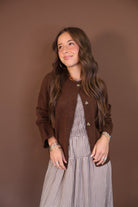 Chocolate Brown Button-Front Cardigan — worn open over a gingham dress.