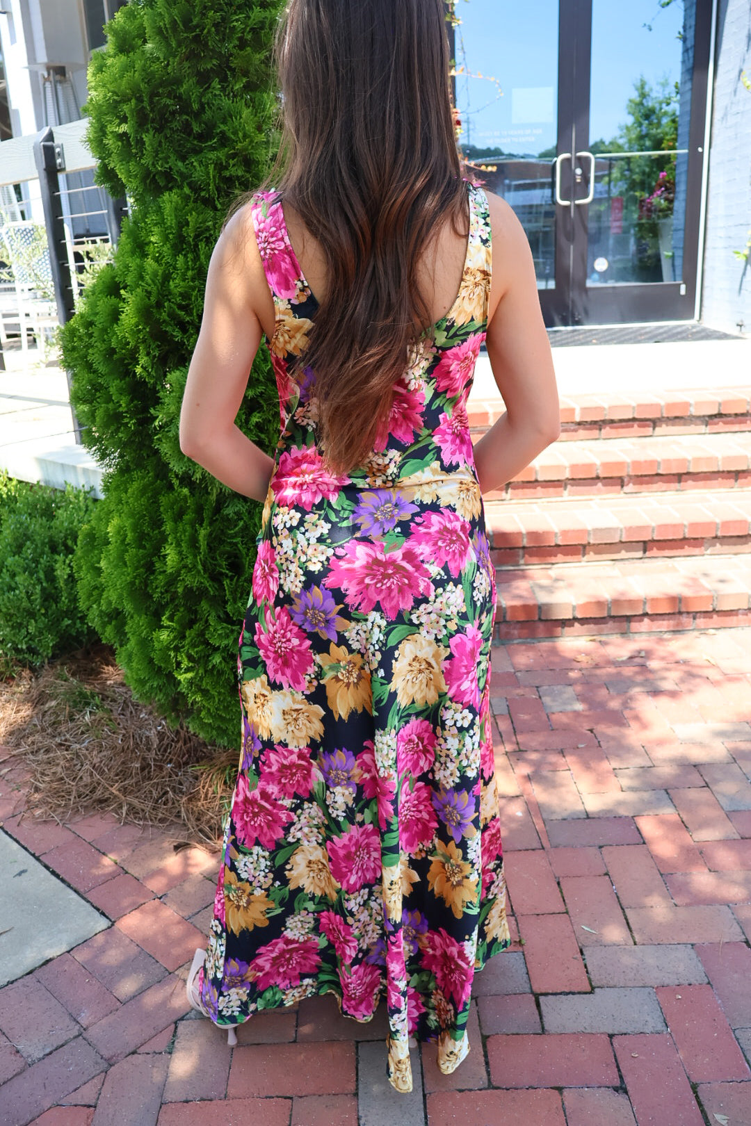 Black floral satin maxi dress with twisted straps and a draped cowl neckline