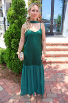 Emerald green satin slip maxi dress with adjustable straps and a detachable neck scarf