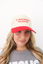 It’s About Presence, Not Presents Trucker Hat